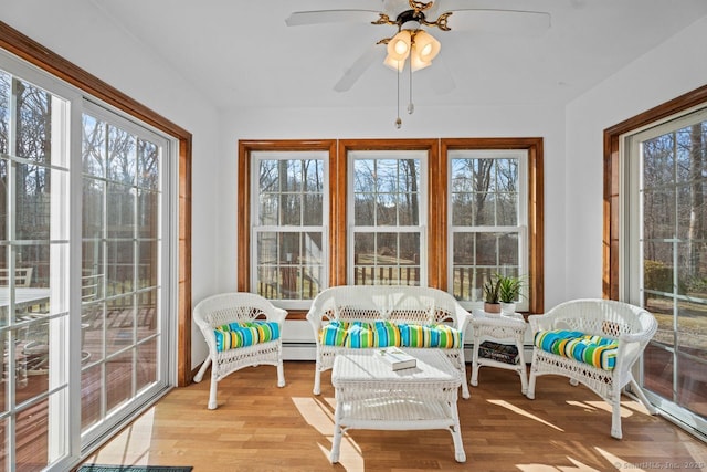 sunroom / solarium with a ceiling fan