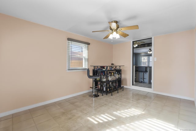 dining room with a dry bar and baseboards