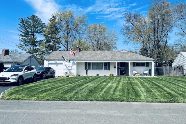 single story home with driveway, an attached garage, covered porch, fence, and a front lawn