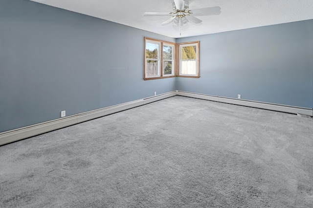 empty room with a textured ceiling, a ceiling fan, and carpet flooring