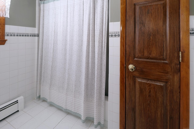 bathroom with shower / bath combination with curtain, baseboard heating, tile patterned flooring, and tile walls