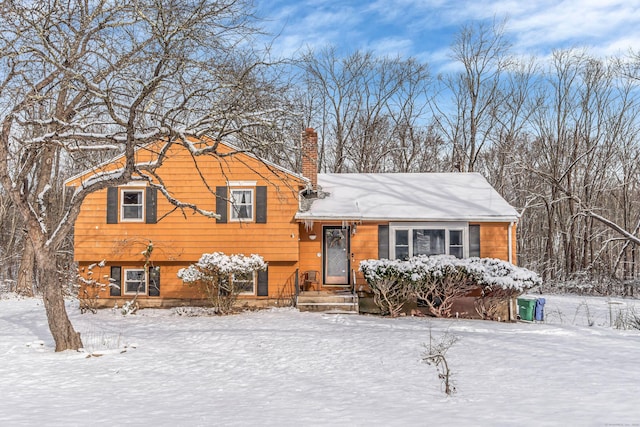 tri-level home featuring a chimney