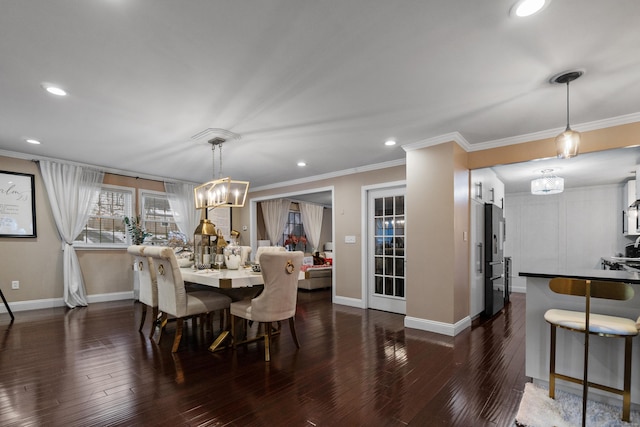 dining room with ornamental molding, dark wood finished floors, and baseboards