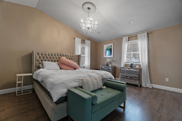 bedroom featuring lofted ceiling, multiple windows, dark wood-style floors, and baseboards