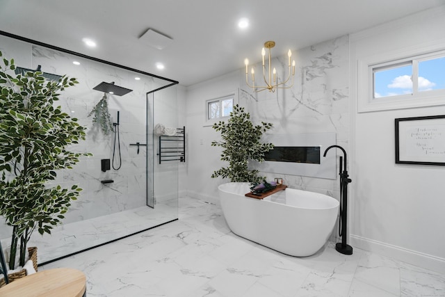 bathroom with recessed lighting, baseboards, a freestanding bath, marble finish floor, and a marble finish shower