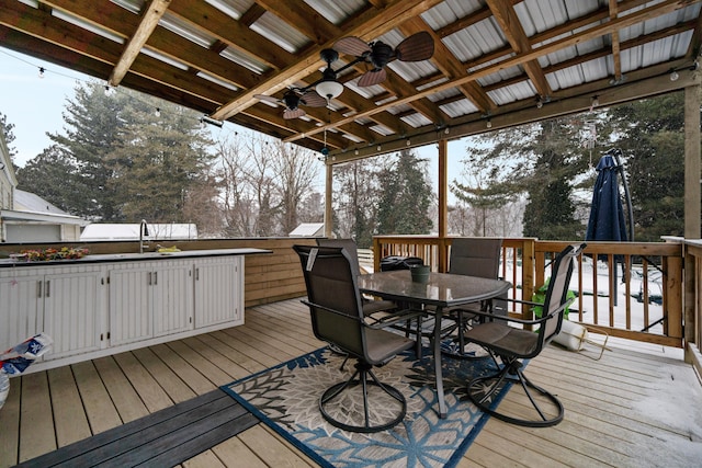 deck with ceiling fan, a sink, and outdoor dining space