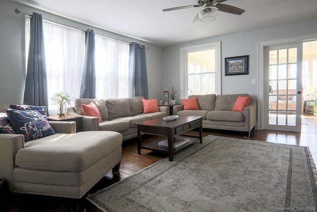 living area featuring ceiling fan and wood finished floors