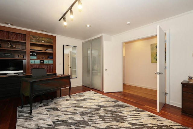 office area featuring crown molding, baseboards, and wood finished floors