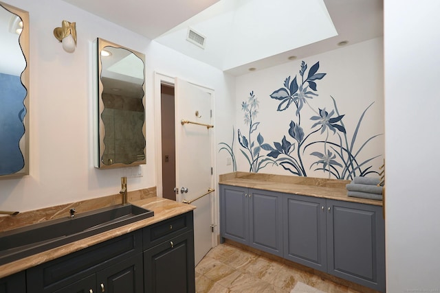 bathroom with visible vents and vanity