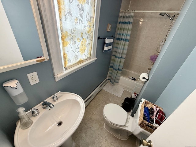 full bath with toilet, tile patterned floors, shower / bathtub combination with curtain, baseboard heating, and a sink