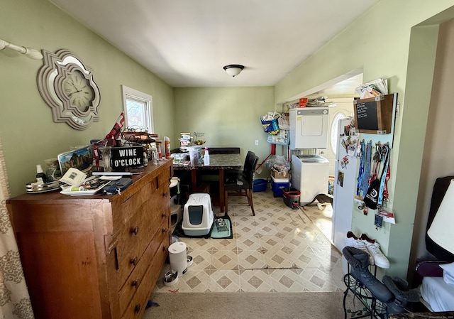 office area with stacked washer and dryer