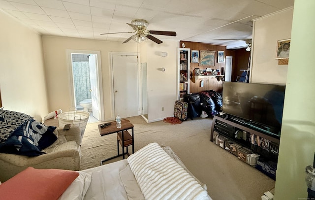 living room with a ceiling fan and light colored carpet