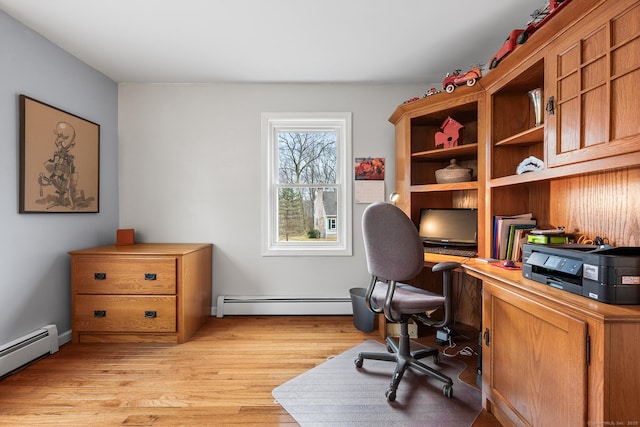 office area featuring baseboard heating and light wood-style floors