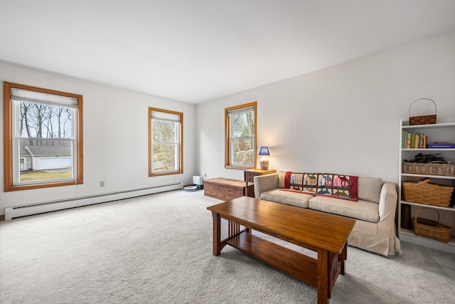 carpeted living area with a baseboard heating unit