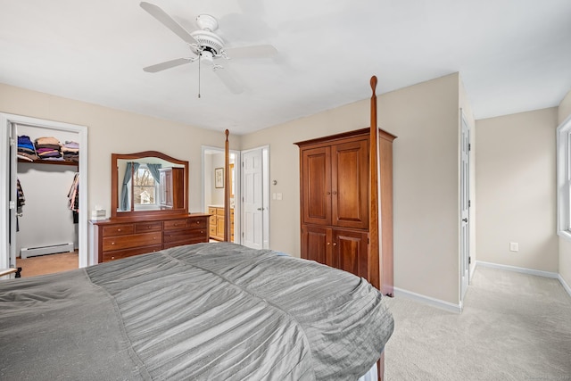 bedroom featuring light carpet, baseboards, a ceiling fan, baseboard heating, and a closet