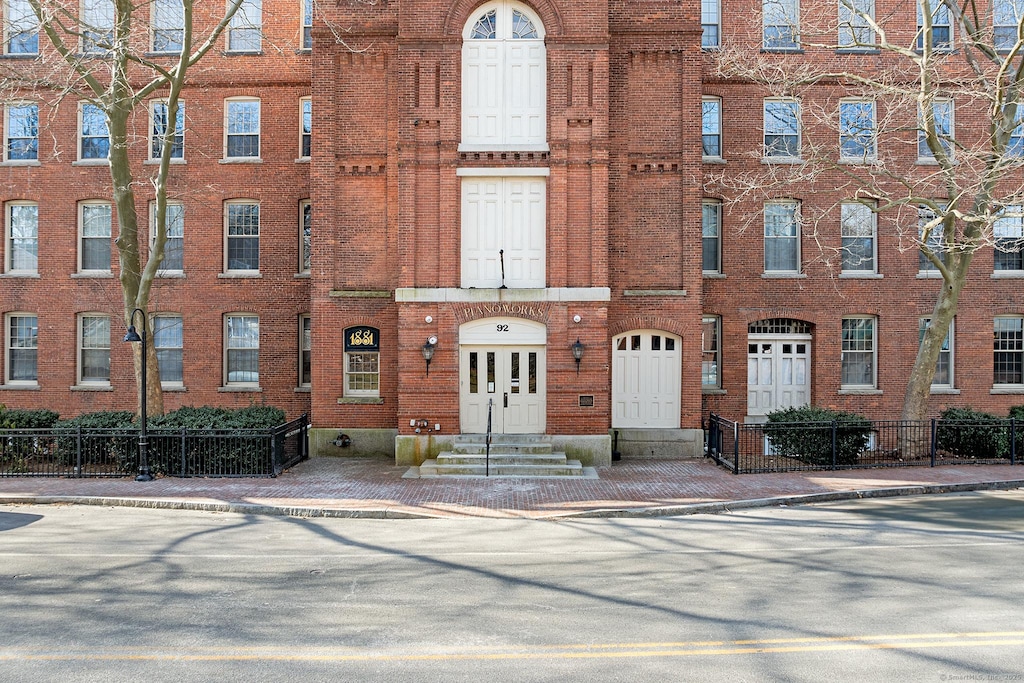 92 Main St Apt 418, Deep River, CT 06417 - view of building exterior with entry steps and fence