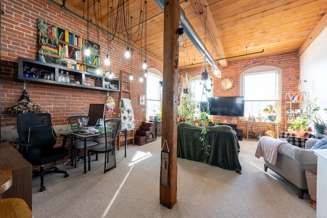 carpeted living room with wooden ceiling, a high ceiling, and brick wall