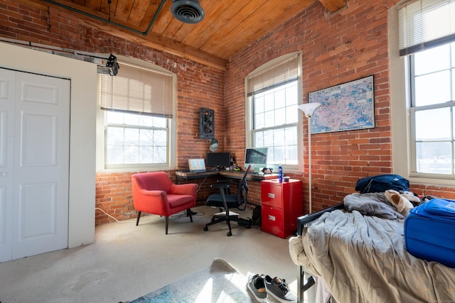 bedroom featuring visible vents, multiple windows, brick wall, and wooden ceiling