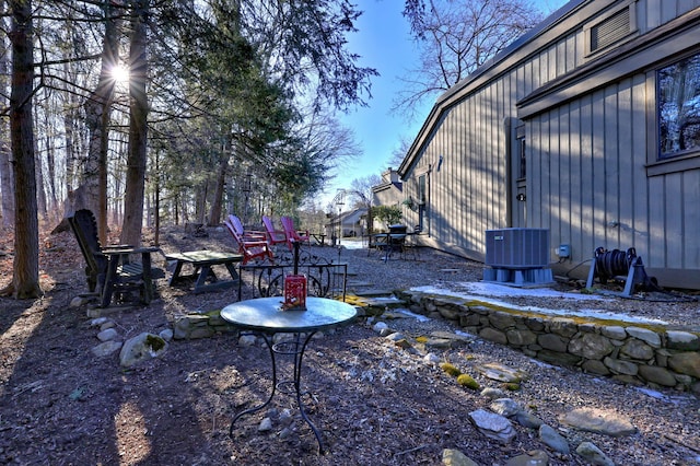 view of yard featuring cooling unit and a patio