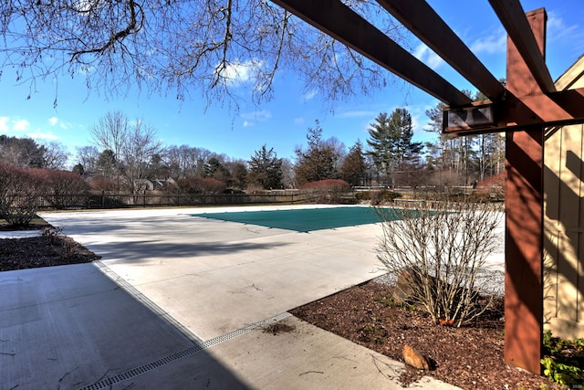 view of pool with a patio area, fence, and a fenced in pool