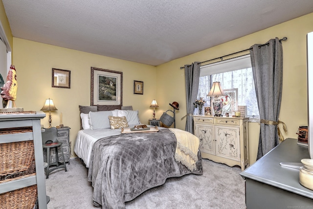 carpeted bedroom featuring a textured ceiling