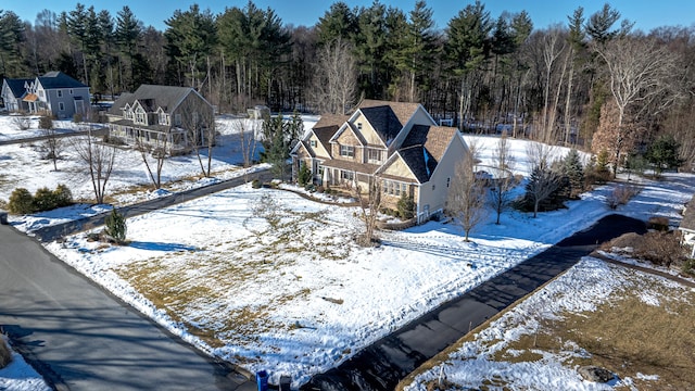 snowy aerial view with a view of trees