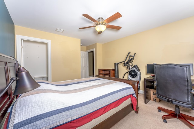 carpeted bedroom featuring ceiling fan, visible vents, and baseboards