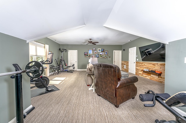 interior space with a ceiling fan, carpet flooring, and baseboards