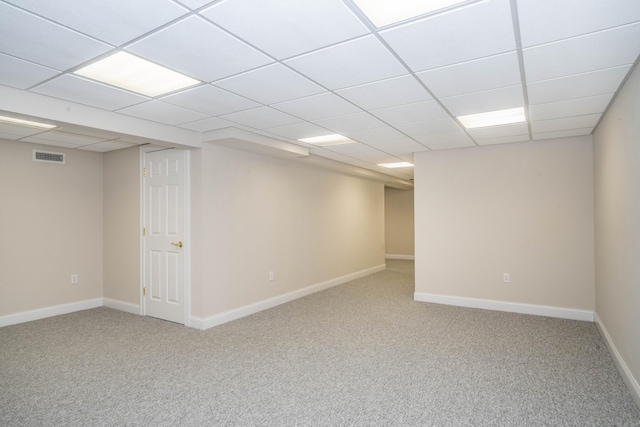 finished basement featuring carpet floors, visible vents, and baseboards