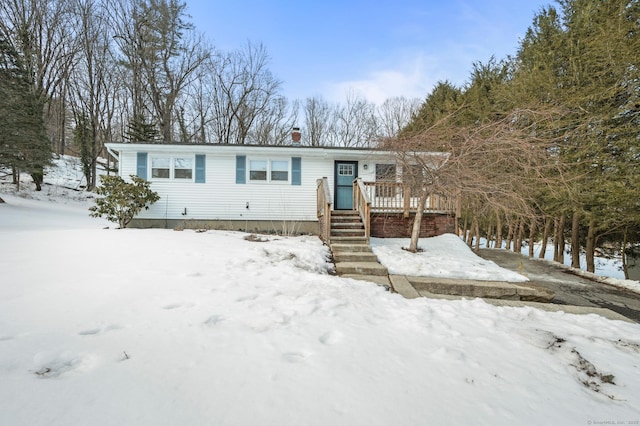 view of front of home featuring a wooden deck