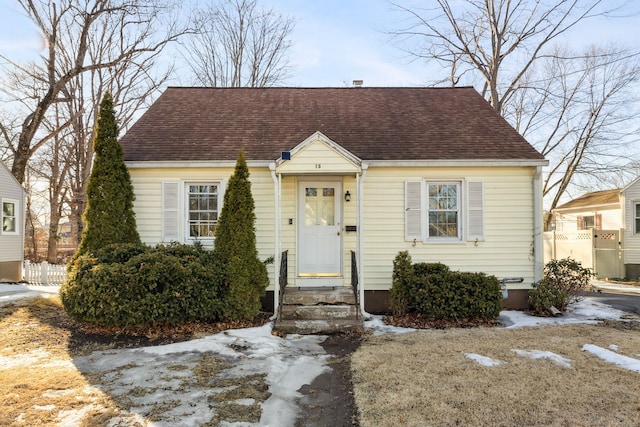 view of front of house with a shingled roof