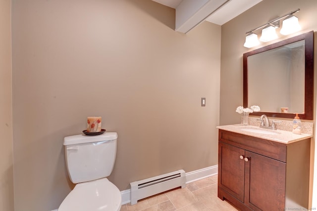 bathroom featuring baseboards, toilet, a baseboard radiator, tile patterned floors, and vanity