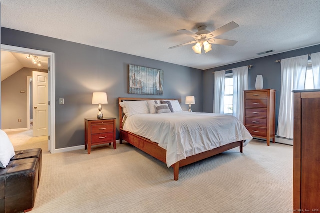 bedroom featuring visible vents, a ceiling fan, light carpet, a textured ceiling, and baseboards