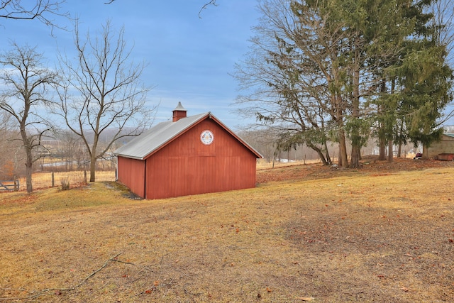 view of pole building with a lawn