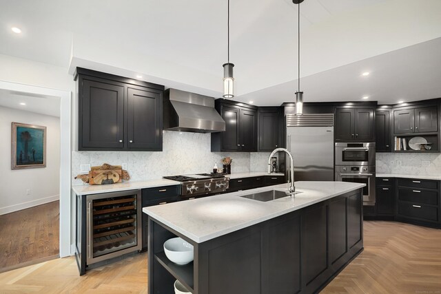 kitchen with wine cooler, stainless steel appliances, a sink, wall chimney range hood, and open shelves