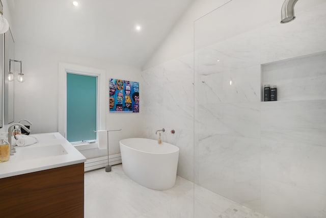 bathroom with a walk in shower, a sink, a freestanding bath, vaulted ceiling, and double vanity