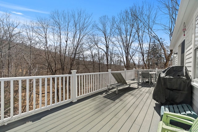 wooden deck with outdoor dining space