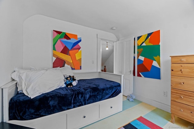 bedroom featuring lofted ceiling