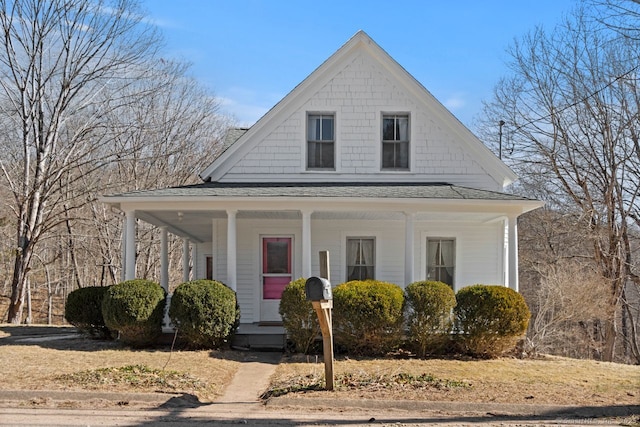 view of front of property featuring covered porch and roof with shingles