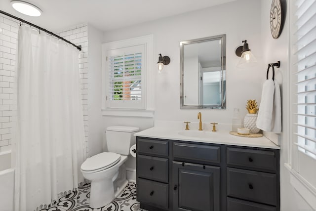 bathroom featuring toilet, tile patterned floors, shower / tub combo with curtain, and vanity