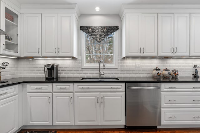 kitchen with dishwasher, dark countertops, glass insert cabinets, and white cabinets