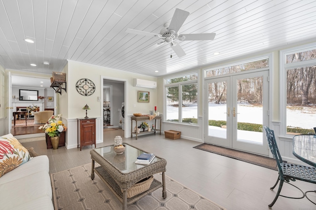 sunroom with an AC wall unit, french doors, and wooden ceiling