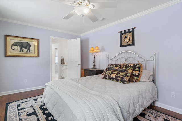 bedroom with crown molding, ensuite bath, baseboards, and wood finished floors