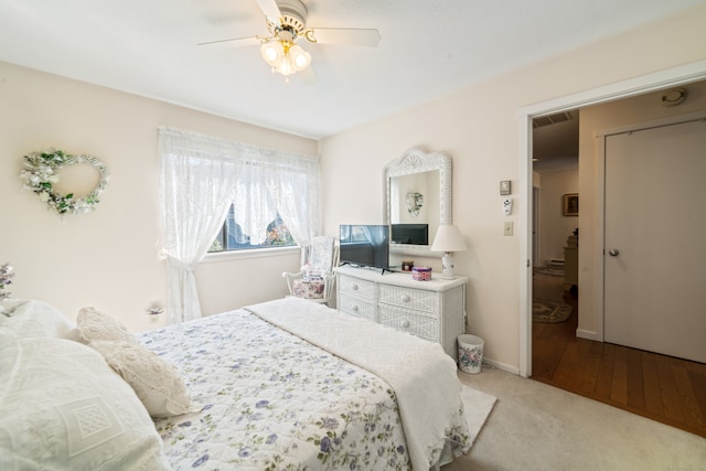 bedroom featuring baseboards, visible vents, carpet, and ceiling fan