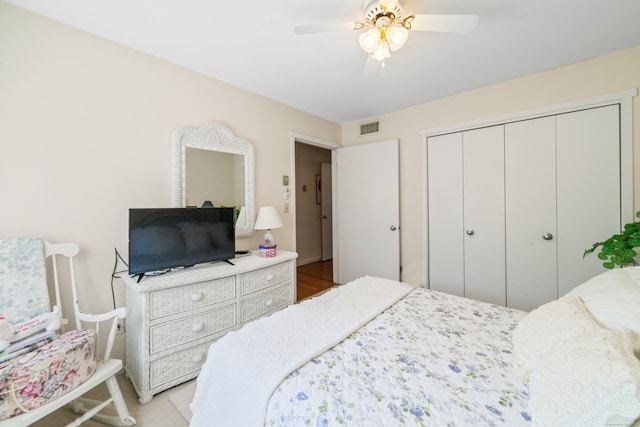 bedroom featuring a closet, visible vents, and ceiling fan