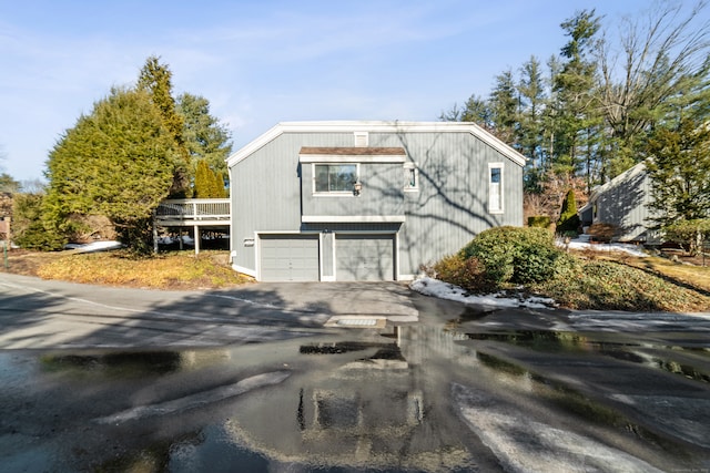 exterior space featuring an attached garage and driveway