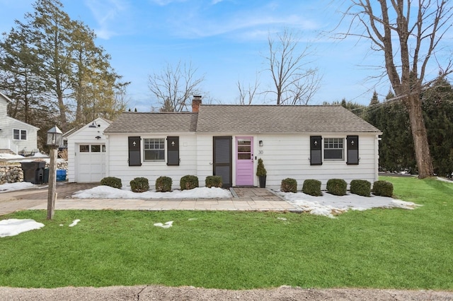 ranch-style home featuring a garage, a front lawn, a chimney, and a shingled roof