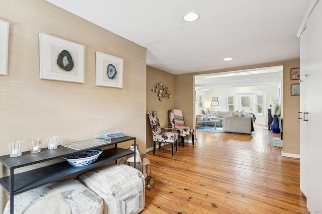 interior space featuring recessed lighting, baseboards, and hardwood / wood-style flooring