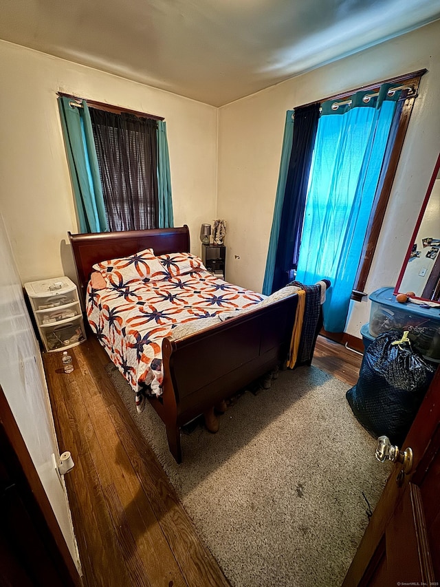 bedroom featuring wood finished floors