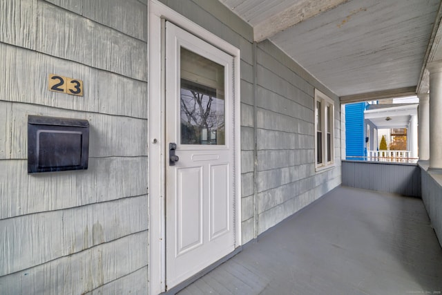 doorway to property with a porch